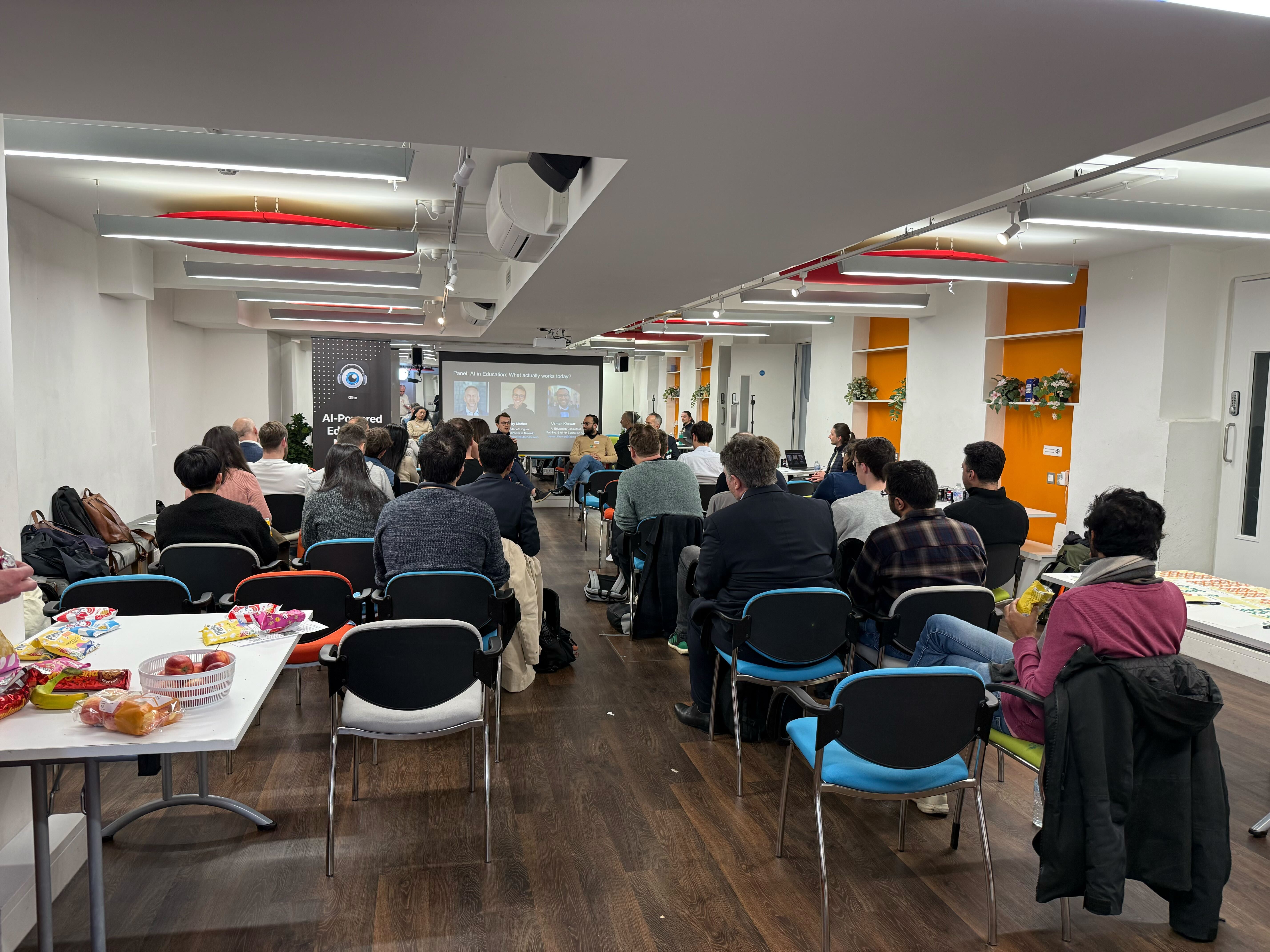 A panel and audience at the Warren Centre with a projected title asking what actually works in AI for education.