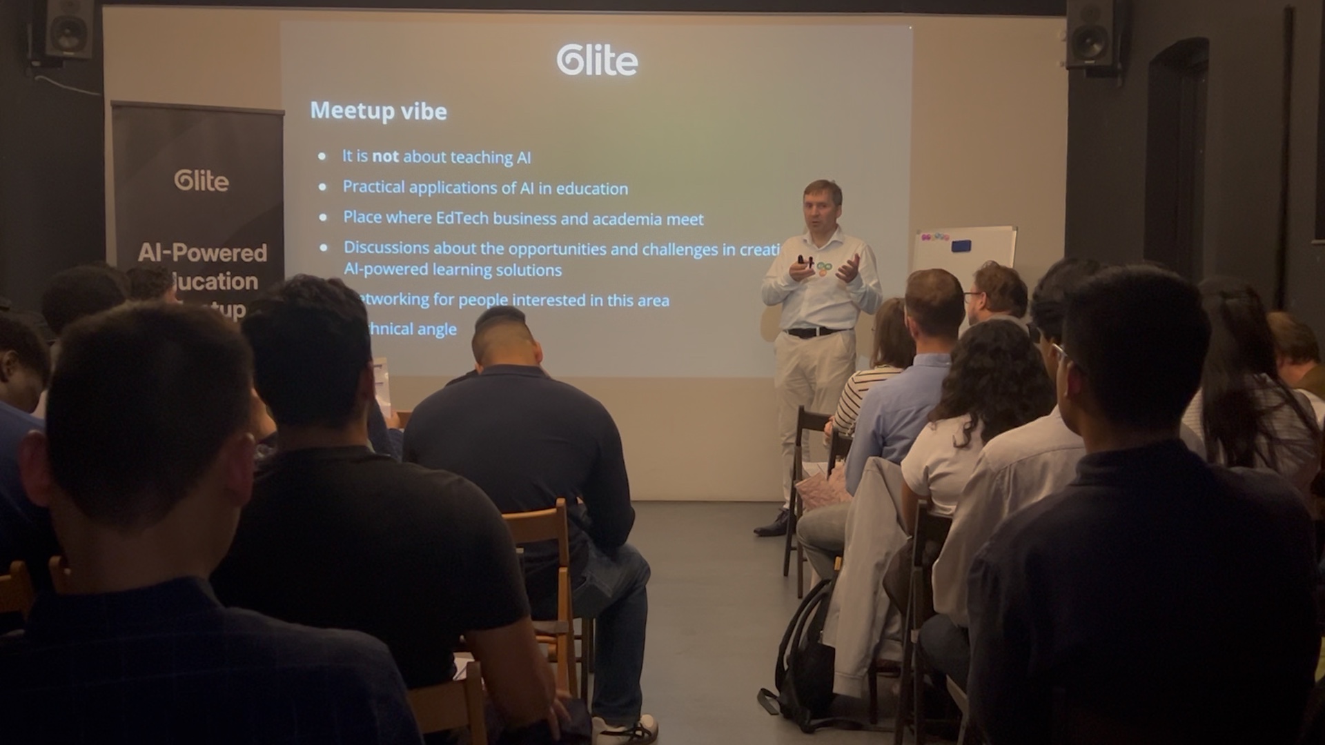 The audience and opening remarks in the meetup room at Anomalous Space on 6 October 2026.